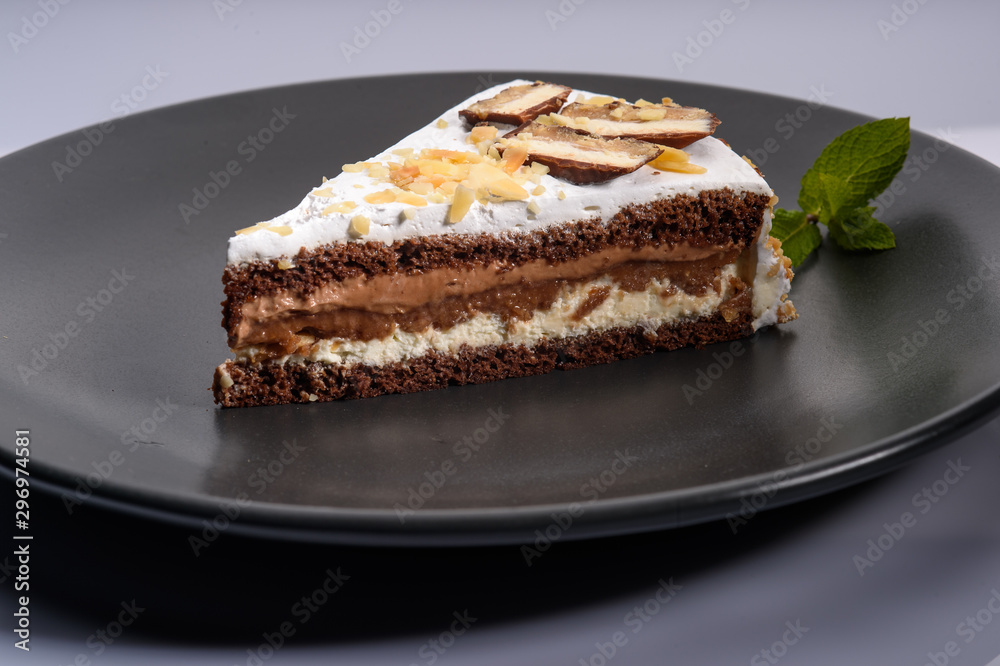 delicious cake with chocolate cream on a black plate8 delicious cake with chocolate cream on a black plate8