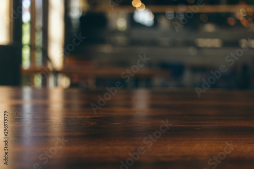 wooden table in front of abstract blurred background