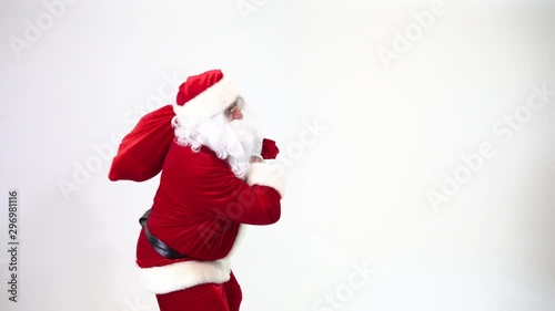 Santa Claus on a white background suffers from back pain, tormented, walks bent over. Intervertebral hernia, protrusion.