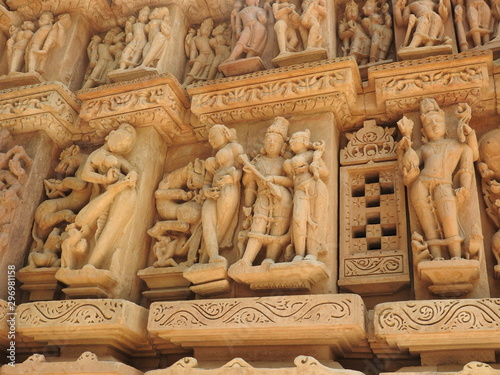 Sex poses from the kamasutra, erotic close - up of intricate carved scenes on the walls of Hindu temples in the Western group of Khajuraho, India