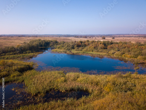 Aerial landscape of a lake in the forest at summer