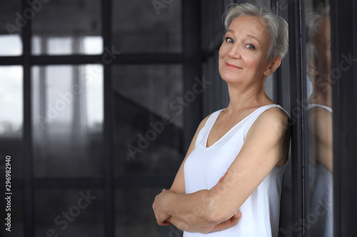 Portrait of happy mature woman indoors, space for text. Smart aging Free Download Portrait of happy mature woman indoors, space for text. Smart aging - GFXLoad