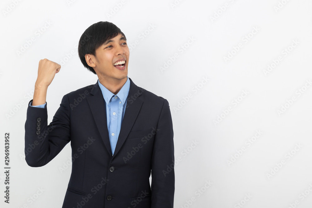 Excited young business Asian man raising his fists with happy delighted face, celebrating success isolated on white background. Excited young business Asian man raising his fists with happy delighted face, celebrating success isolated on white background.