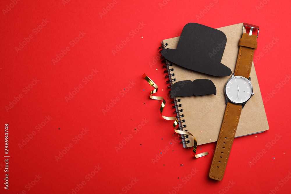 Flat lay composition with men's accessories on red background, space for text. Greeting card Flat lay composition with men's accessories on red background, space for text. Greeting card