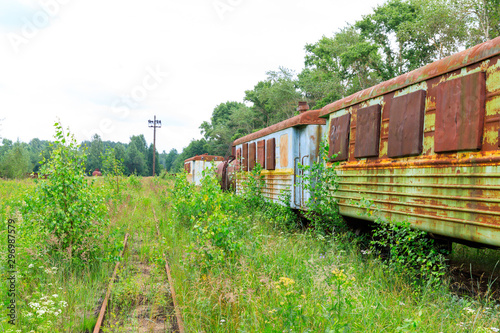 abandoned narrow gauge railway, Branches of the railway at the marshalling yard, forest and lonely road in the middle Russia