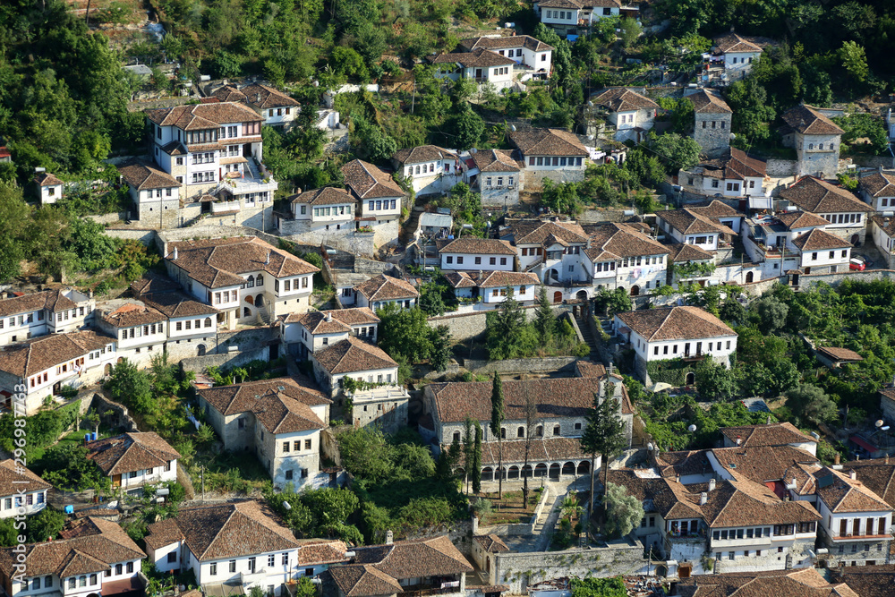 Berat, Albania -  July 2019: View of old city houses  of Berat, designated a UNESCO World Heritage. City of thousand windows.