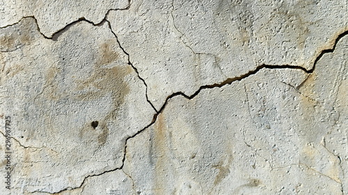  A crack on the concrete wall surface of a house in Los Angeles. Background image for design