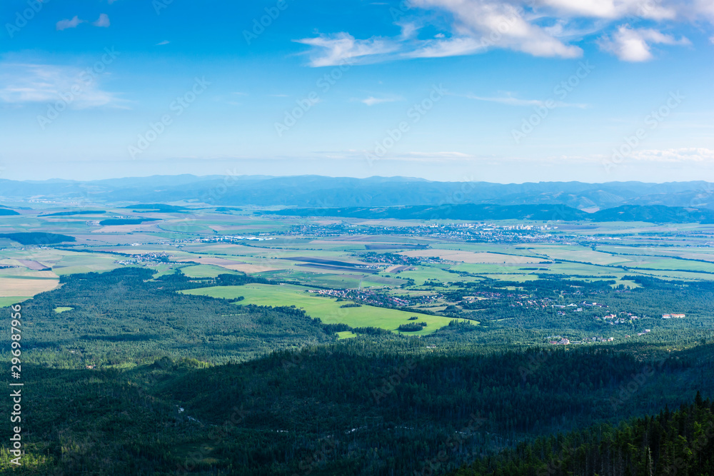 View of the lowlands and, among others, the city of Poprad from the Tatra Mountains. On the horizon visible range of the Low Tatras. Slovakia.
