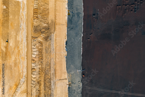 Aerial drone photography of an enormous sand pit construction site. 