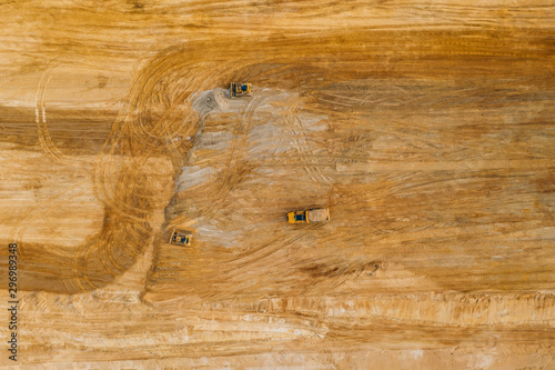 Aerial drone photography of an enormous sand pit construction site. 