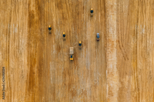 Aerial drone photography of an enormous sand pit construction site. 