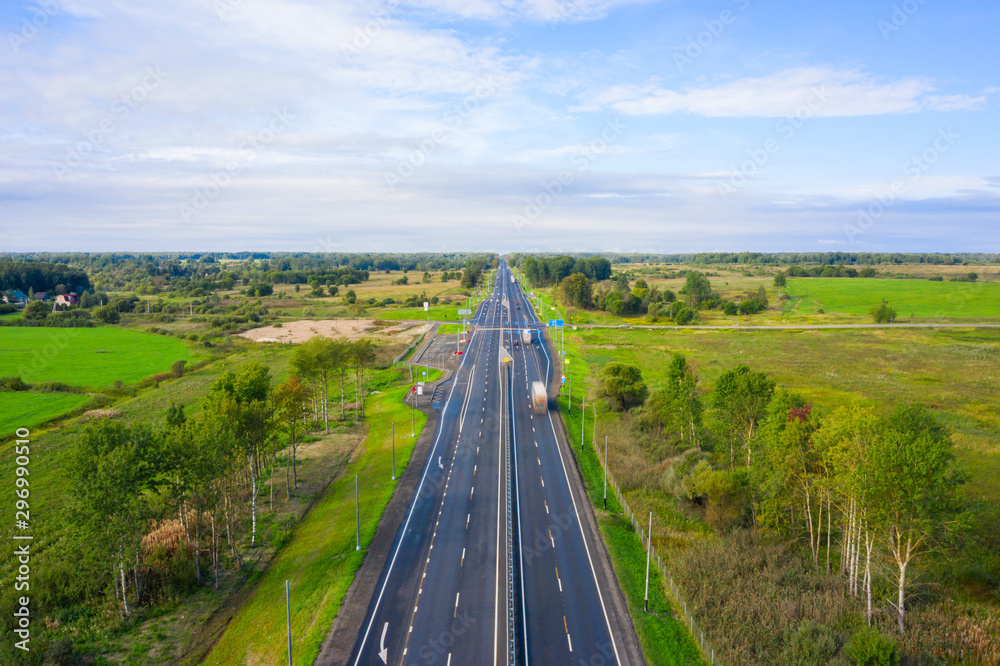 Beautiful hight way road on an early summer morning in central Russia. Moscow-Minsk M1 highway, Bird's eye view of the road and skyline