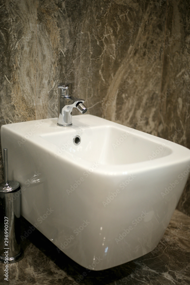 Fototapeta premium Toilet and bide bathroom isolated on black background.