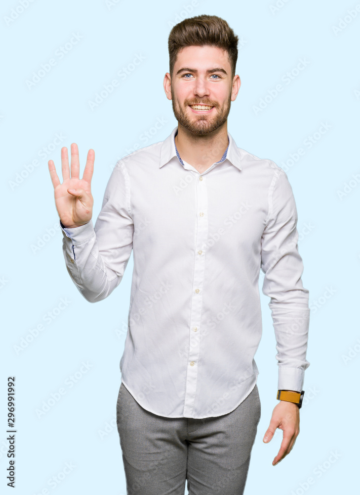Young handsome business man showing and pointing up with fingers number four while smiling confident and happy. Young handsome business man showing and pointing up with fingers number four while smiling confident and happy.