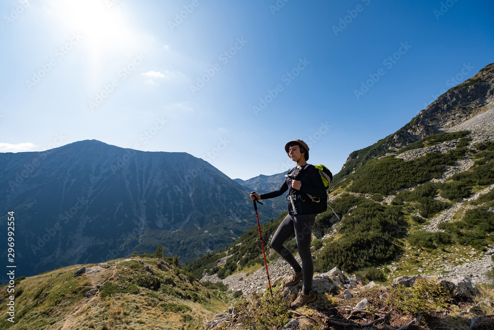 Young woman traveler in the bulgarian mountains , hiking in the sunny day Young woman traveler in the bulgarian mountains , hiking in the sunny day