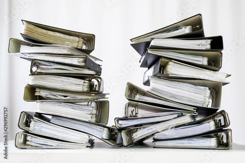 Papier peint stacks of many ring binder with files, folders and documents on an office desk,