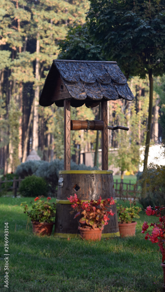 Little wooden well in the forest