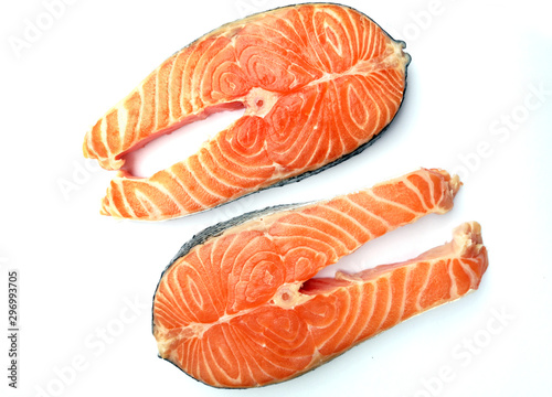 Two salmon steaks on white