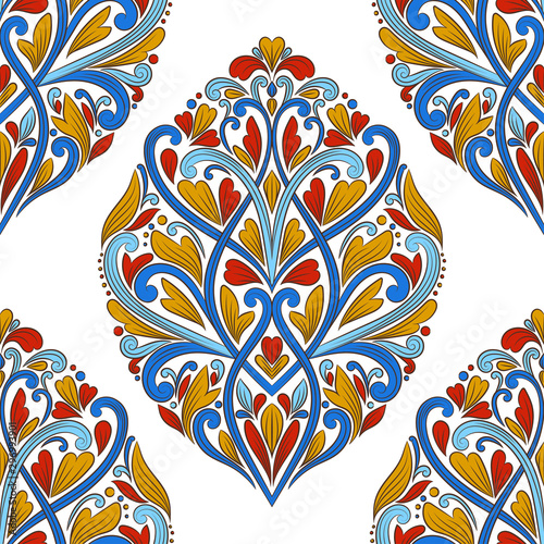 Red, blue and yellow luxury floral ornament seamless pattern. Traditional Turkish, Indian motifs. Great for fabric and textile, wallpaper, packaging or any desired idea.