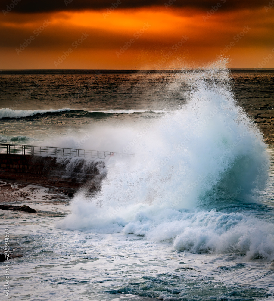 waves crashing on the dock