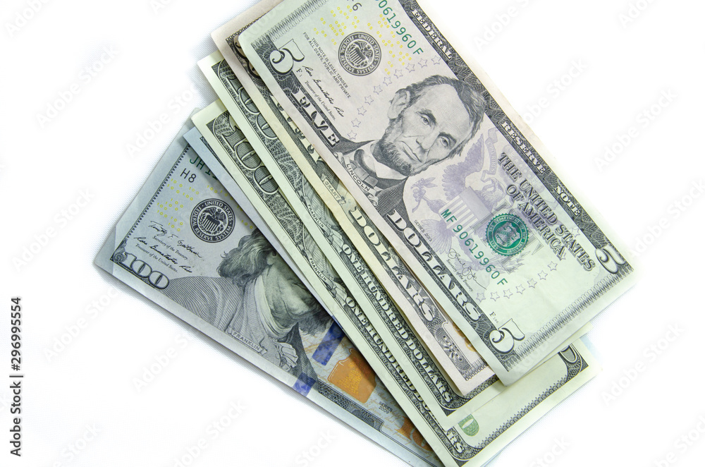 American dollars denominations of one hundred, fifty, five. Arranged in a chaotic manner, a short flight of stairs, a bill on a bill. Old sample and new notes. Dollars in hands are twisted into a tube American dollars denominations of one hundred, fifty, five. Arranged in a chaotic manner, a short flight of stairs, a bill on a bill. Old sample and new notes. Dollars in hands are twisted into a tube