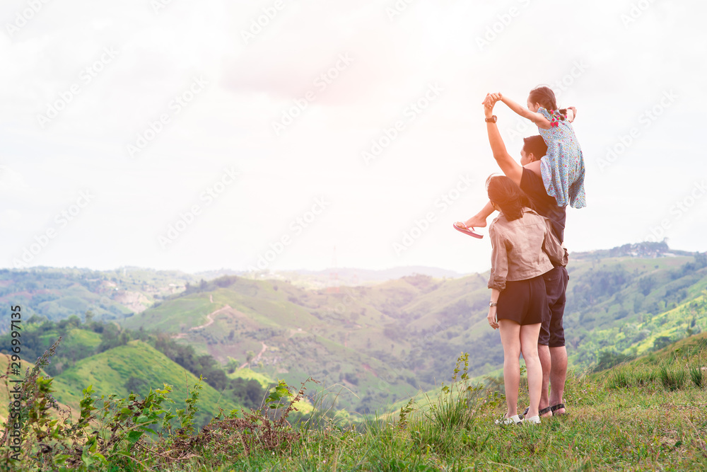 Asian little girl on his father shoulder standing on the top of mountain. Asian little girl on his father shoulder standing on the top of mountain.
