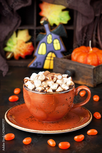 Halloween  time composition with cookies and hot chocolate mug