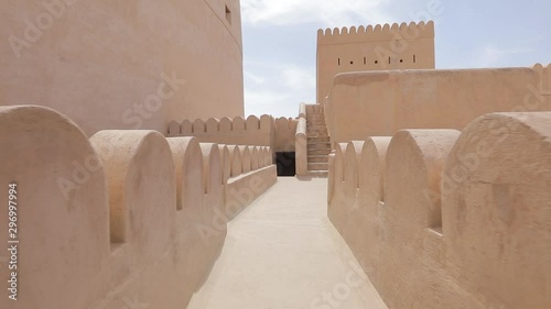 Nizwa Fort, Oman. Traditional Omani fortress, general plan and details. Camera movement along the corridor on the fortress wall.