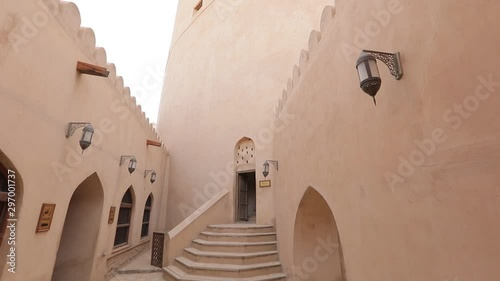 Nizwa Fort, Oman. Traditional Omani fortress, general plan and details. Camera movement along the corridor on the fortress wall.