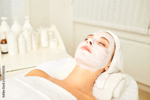 Facial skin treatment with a cosmetic mask in a beauty salon.