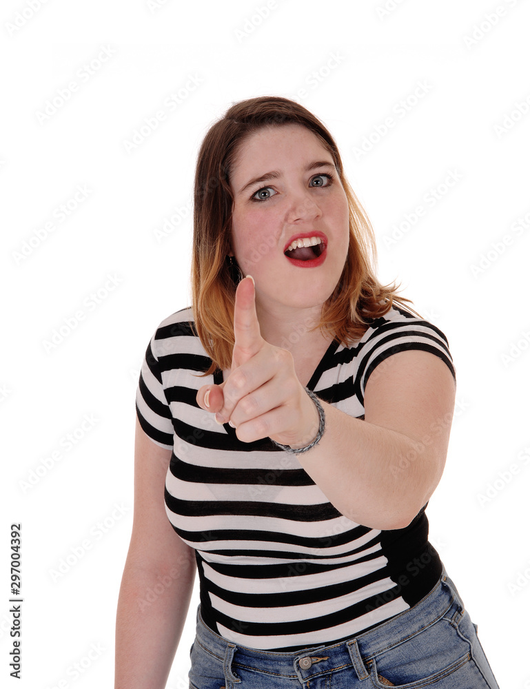 Young woman shouting and pointing finger Young woman shouting and pointing finger