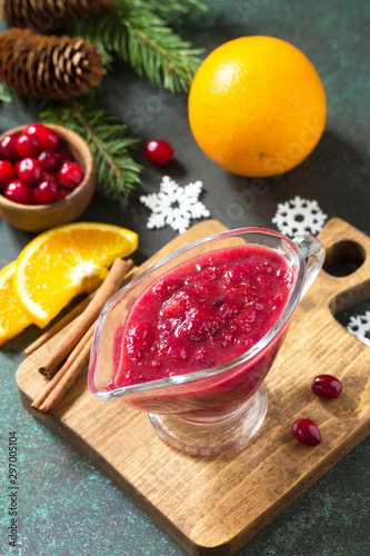 Cranberry sauce. Homemade Thanksgiving Cranberry Sauce with Orange Zest and ingredients for cooking on stone table.