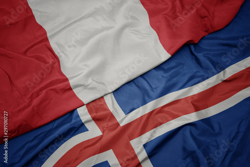 waving colorful flag of iceland and national flag of peru.