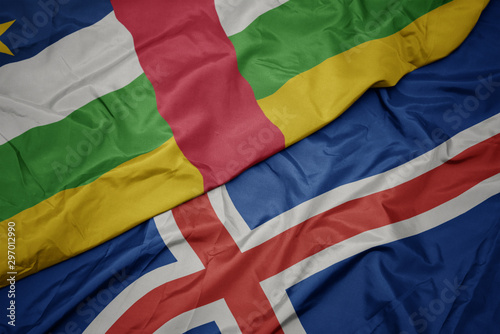 waving colorful flag of iceland and national flag of central african republic.
