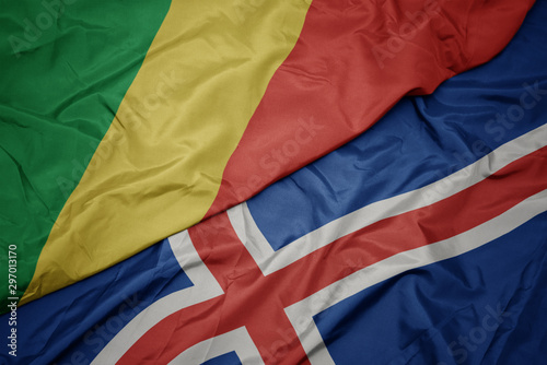 waving colorful flag of iceland and national flag of republic of the congo.