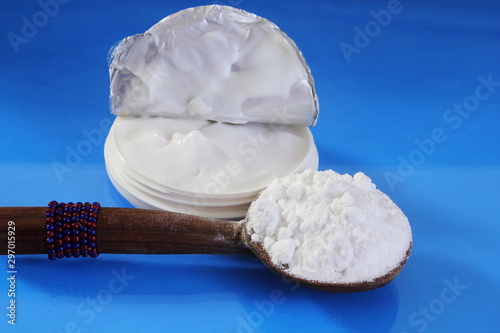 boric acid powder in spoon with boric cream  photo