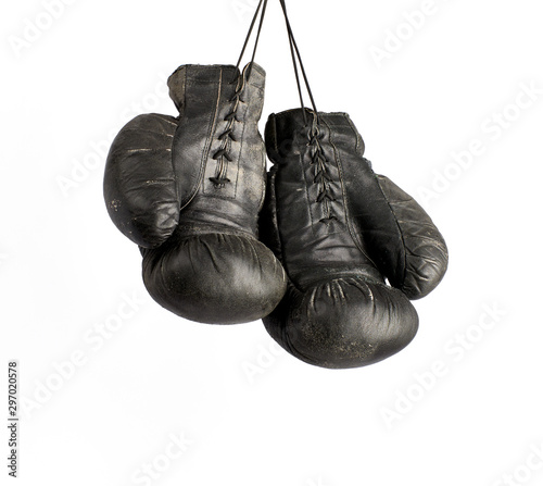 pair of very old vintage black leather boxing gloves © nndanko