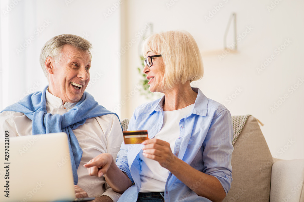 Online shopping. Elderly couple buying things on Internet