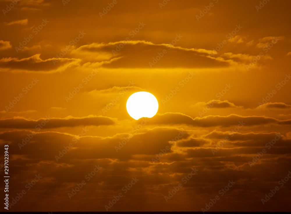  sunset with clouds with spherical and orange sun