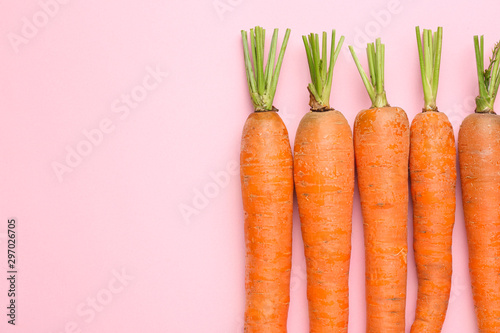 Fresh carrots on color background photo