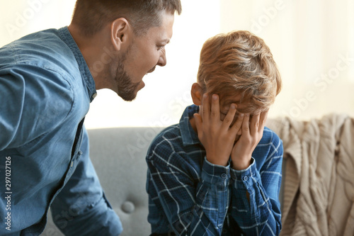 Fotografie Father scolding his little son at home