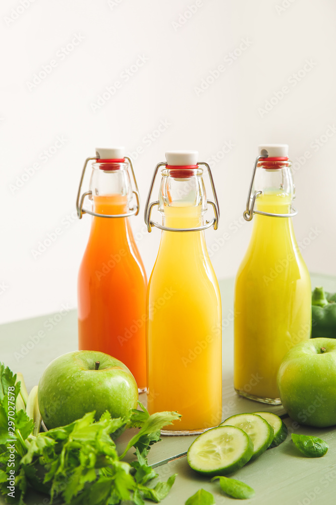 Bottles of fresh juice on table Bottles of fresh juice on table