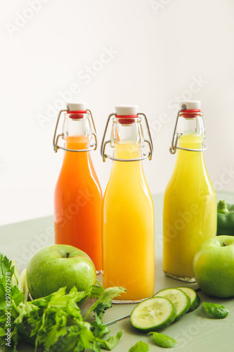 Bottles of fresh juice on table