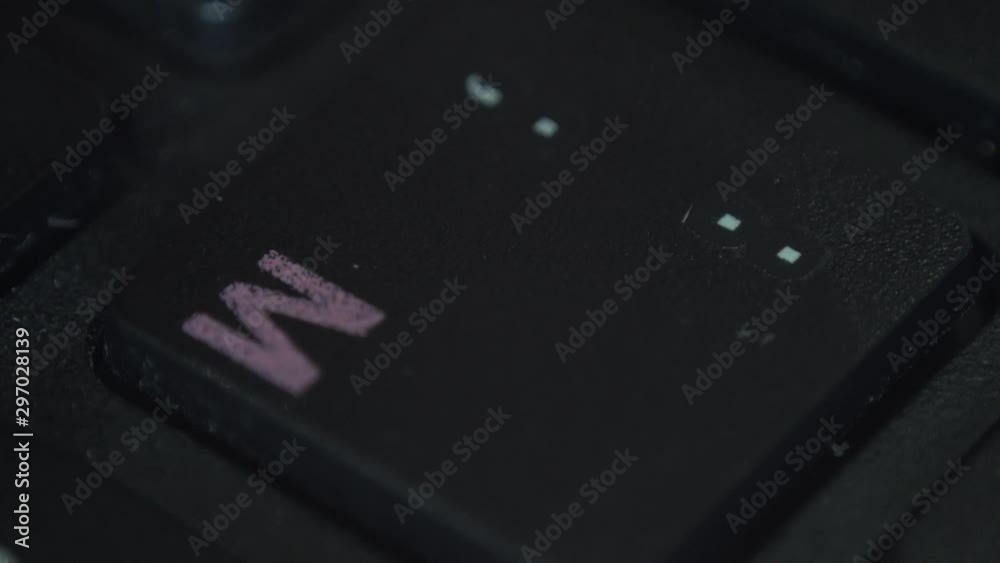 Closeup of a finger pressing a key on a computer keyboard Closeup of a finger pressing a key on a computer keyboard