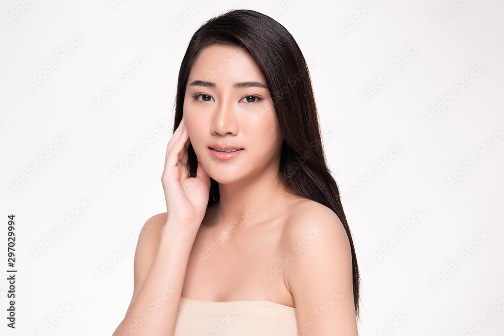 Beautiful Asian young woman touching soft cheek and smile with clean and fresh skin. Happiness and cheerful with, isolated on white background, Beauty and Cosmetics Concept,