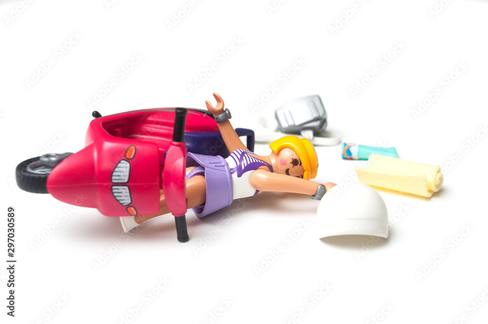 Mulhouse - France - 20 October 2019 - Closeup of Playmobil figurine falling  from scooter on white background foto de Stock | Adobe Stock