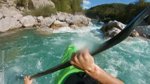 A kayaker's POV of paddling through rapids photo