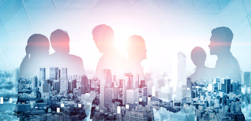 Double exposure image of many business people conference group meeting on city office building in background showing partnership success of business deal. Concept of teamwork, trust and agreement.
