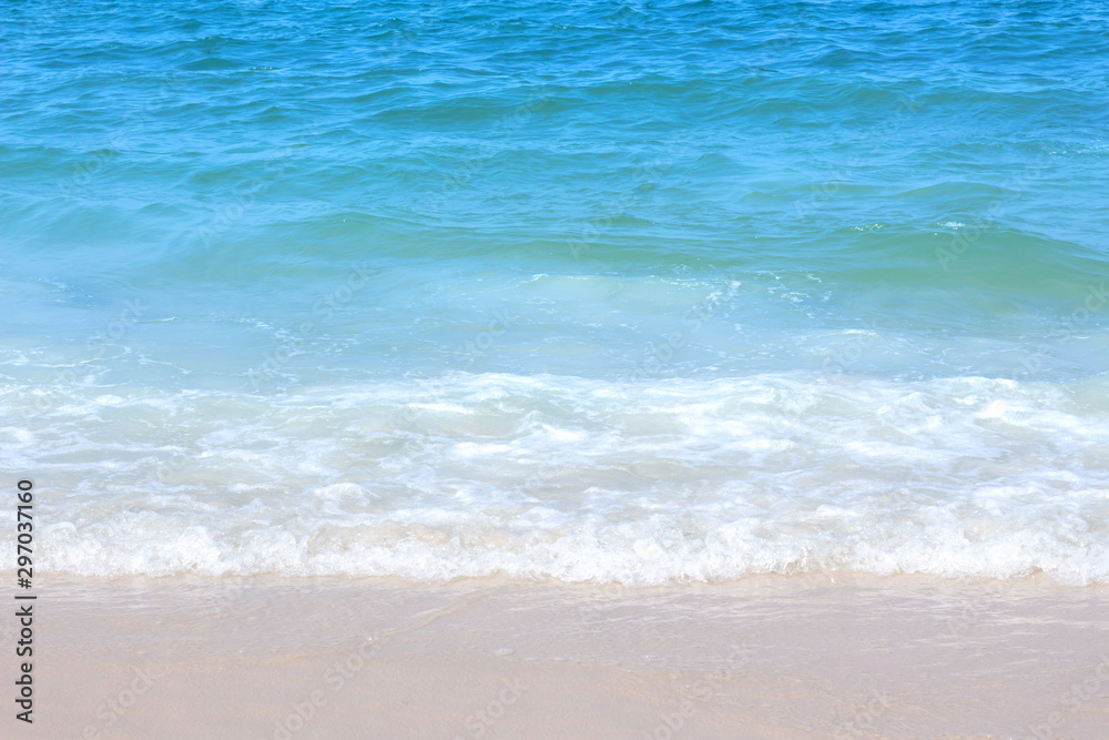 Blue Sea waves on a sandy beach