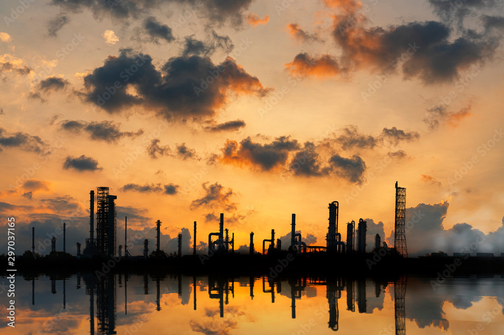 silhouette , oil and gas refinery industry plant along twilight